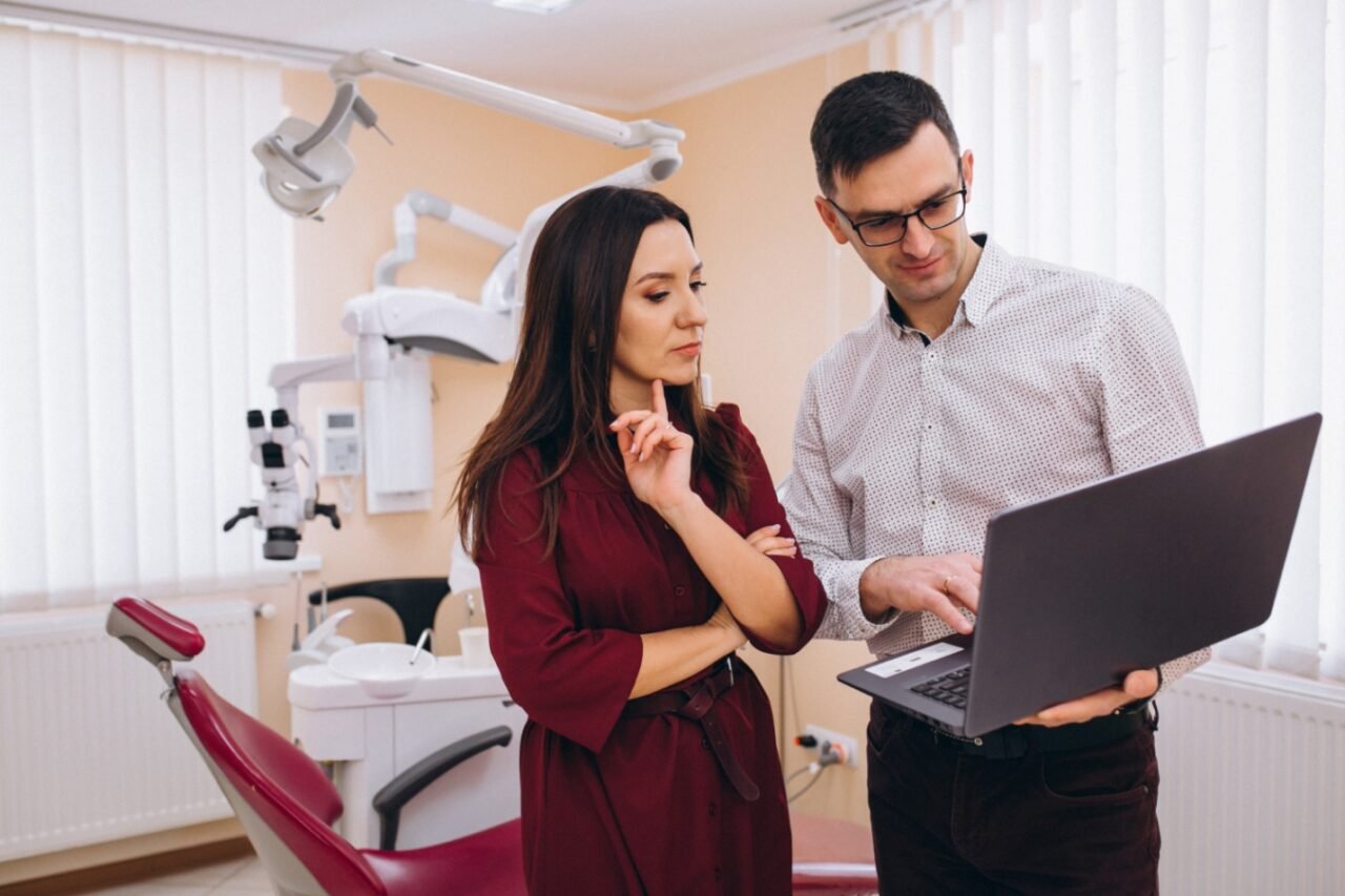 Houston dentist checking a patient's loose denture
